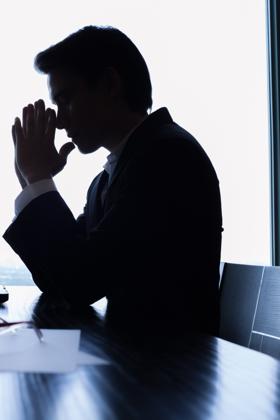 Silhouette of a man thinking pensively