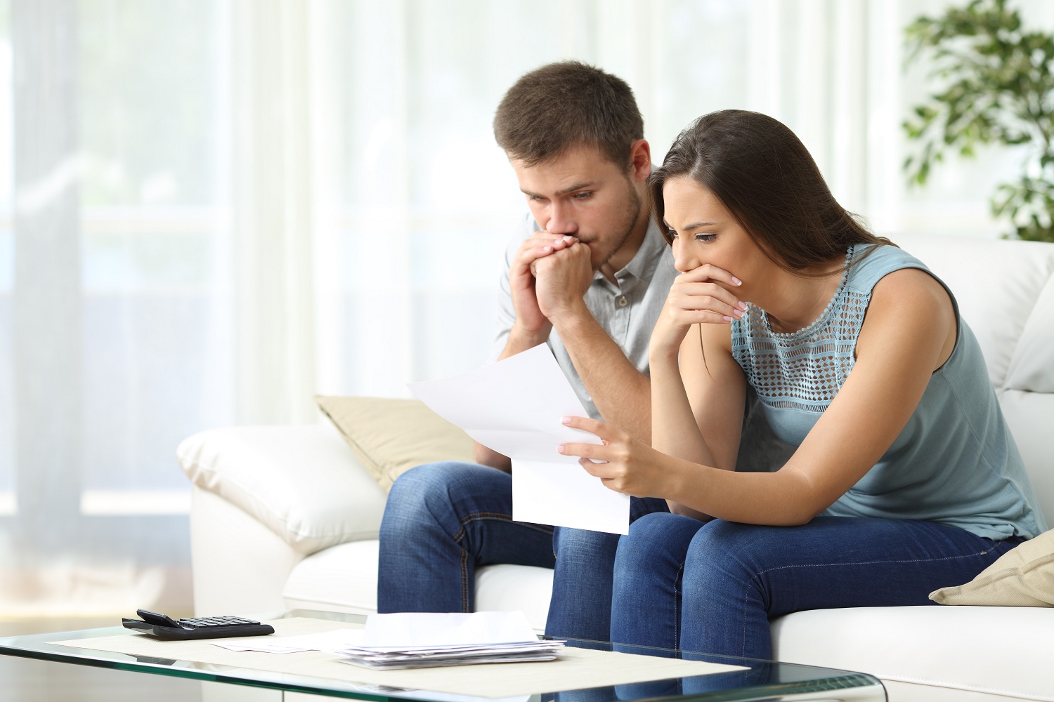Homeowners reviewing their financial documents